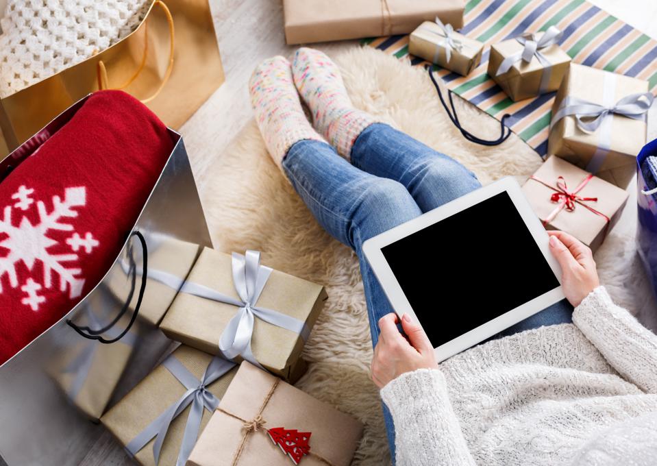 Woman shopping online with a credit card